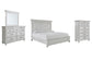 Kanwyn King Panel Bed with Mirrored Dresser and Chest Rent Wise Rent To Own Jacksonville, Florida